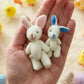 🐇 62% OFF! 🐇 Bunny Mummy & Baby Plush Pocket Tin – Handmade Easter Collectible with Cozy Blanket (Pink/Blue Ears) 🐇🎁